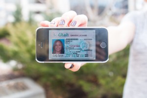 A sample driver's license is displayed on a smartphone, which is a technology that could come to Utah residents. Legislators are exploring digital driver's licenses but haven't yet said what they might look like. (Maddi Driggs)