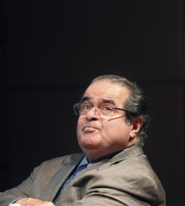 FILE - In this Oct. 18, 2011 file photo, U.S. Supreme Court justice Antonin Scalia looks into the balcony before addressing the Chicago-Kent College Law justice in Chicago. On Saturday, Feb. 13, 2016, the U.S. Marshals Service confirmed that Scalia has died at the age of 79. (AP Photo/Charles Rex Arbogast, File)