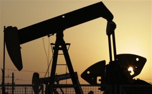 Oil pumps work in the desert oil fields of Sakhir, Bahrain.(Associated Press)
