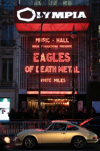 A crowd waits outside the Olympia music hall the Eagles of Death Metal's concert, in Paris, Tuesday, Feb. 16, 2016. Survivors of November's deadly Paris attacks opened up to a French terrorism commission ahead of a highly charged Paris concert by Eagles of Death Metal , the U.S. rock band that was performing in the Bataclan concert hall the night extremist suicide bombers targeted sites around the French capital. (AP Photo/Thibault Camus)