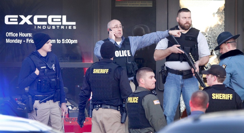 Police guard the front door of Excel Industries in Hesston, Kan., Thursday, Feb. 25, 2016, where a gunman killed an undetermined number of people and injured many more. (Fernando Salazar/The Wichita Eagle via AP)