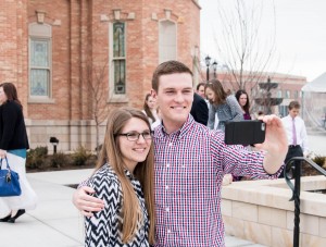 Aubrey Hunt and Kyler Sant take a selfie in front of the Provo City Center Temple.