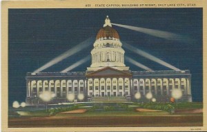 An old postcard shows Utah's Capitol lit at night.