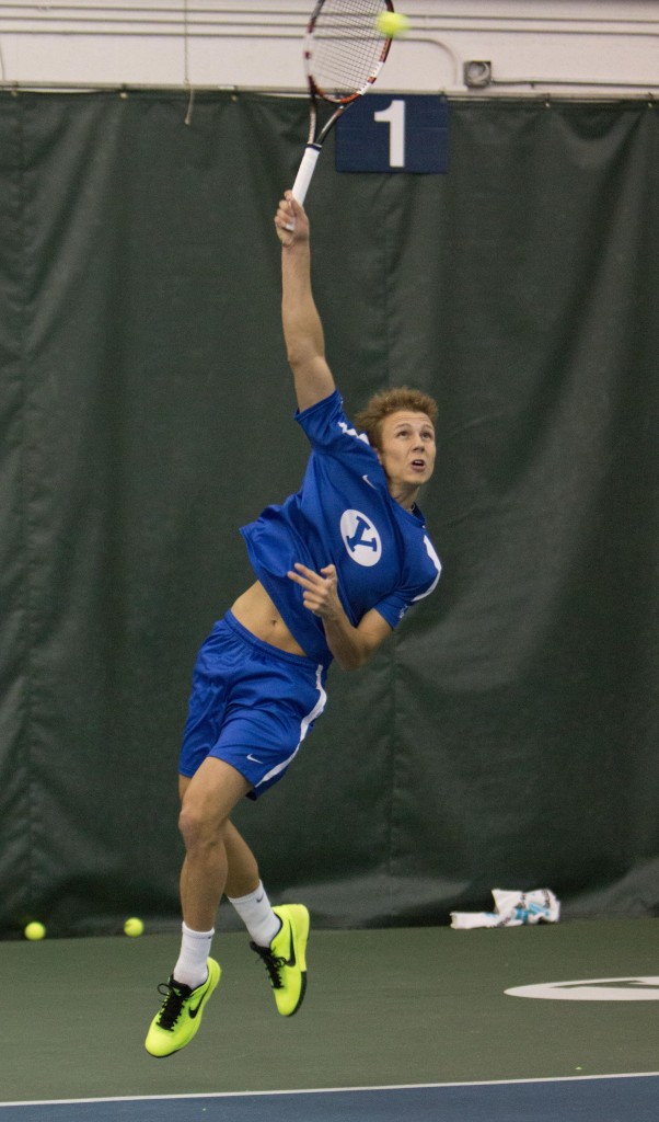 Jeremy Bourgeois reaches for a serve at a home match earlier this season. (Natalie Bothwell)