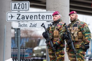 Belgian Army soldiers patrol at Zaventem Airport in Brussels on Wednesday, March 23, 2016. Belgian authorities were searching Wednesday for a top suspect in the country's deadliest attacks in decades, as the European Union's capital awoke under guard and with limited public transport after 34 were killed in bombings on the Brussels airport and a subway station. (AP Photo/Geert Vanden Wijngaert)