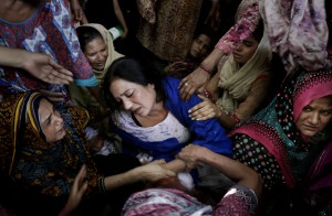 Women try to comfort a mother who lost her son in bomb attack in Lahore, Pakistan, Monday, March 28, 2016. The death toll from a massive suicide bombing targeting Christians gathered on Easter in the eastern Pakistani city of Lahore rose on Monday as the country started observing a three-day mourning period following the attack. (AP Photo/K.M. Chaudary)