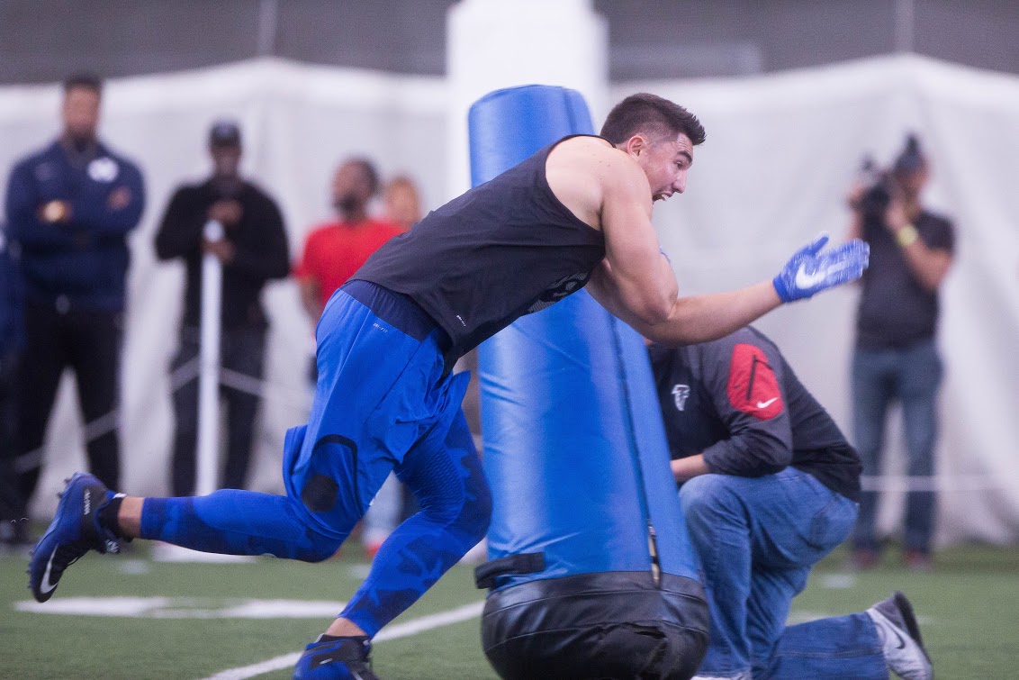 Bronson Kaufusi works on a bag drill during Pro Day. Kaufusi is projected as a second to fourth round draft pick. (Ari Davis)