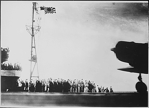 Captured Japanese photograph taken aboard a Japanese carrier before the attack on Pearl Harbor, December 7, 1941. Flying on the carrier is the Japanese war flag, or rising sun flag. (National Archives)
