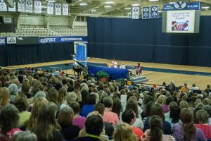 Hagen and Rosenberg speak to a crowded audience in the Smith Fieldhouse. (Maddi Dayton)