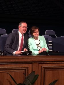 Sister Linda K. Burton, the General Relief Society President, seated next to her husband Craig Burton before the start of women's conference (Mariana Chrisney).