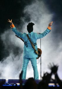 FILE - In this Feb. 4, 2007 file photo, Prince performs during the halftime show at Super Bowl XLI at Dolphin Stadium in Miami. Prince's publicist has confirmed that Prince died at his home in Minnesota, Thursday, April 21, 2016. He was 57. (AP Photo/Chris Carlson, File)