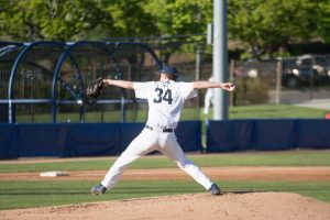 Jordan Wood delivers a pitch against UVU last week. The Cougars dropped two games against Pepperdine over the weekend. (Natalie Saunders) 
