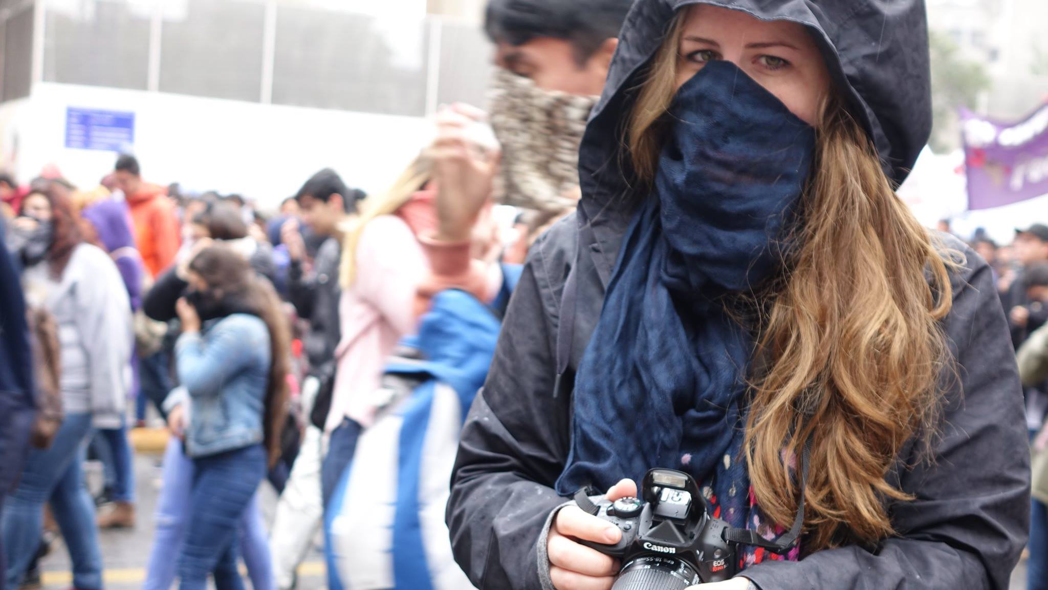 Kjersten Johnson protecting herself from the tear gas. 
