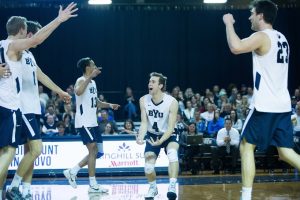 The BYU men's volleyball team celebrates after scoring a point against UCSB. Seven Cougars received All-Academic honors. (Universe Archives)