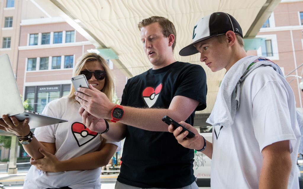 Dillon Talbot_W1_6660 Catharine Delong, Andrew Forrest and Dillon Talbot demonstrate how they can act as proxy players of Pokemon Go for Dillon's brother Camron's who is a patient at Primary Children's Hospital. The BYU AdLAB created a way for hospital patients to play the game though proxy's in the real world. June 25, 2016 Photo by Jaren Wilkey/BYU © BYU PHOTO 2016 All Rights Reserved photo@byu.edu (801)422-7322