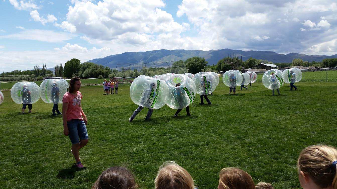 A group of young adults play with the bubble balls or "zorbs." Utah Bubble Sports was an unexpected success for Jared Richards. (Jared Richards)