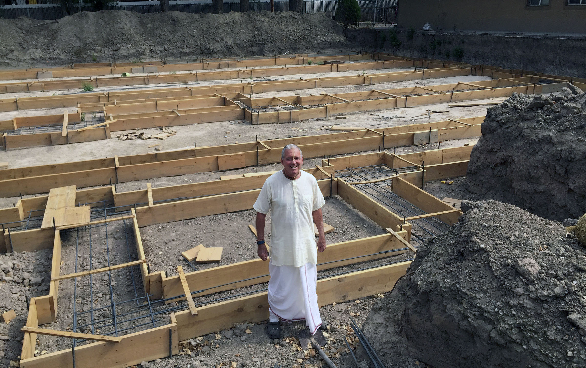 In this Aug. 4, 2016 photo, Caru Das, Utah Hare Krishna leader,poses at the construction site for the Salt Lake City Krishna Temple in Salt Lake City. (AP Photo)