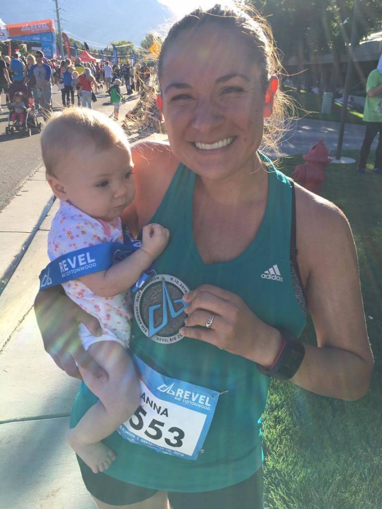 Anna Young holds her daughter after crossing the finish line for the Big Cottonwood Half Marathon. Young would later post a photo of herself pumping breast milk while running, which would go viral. (Anna Young)