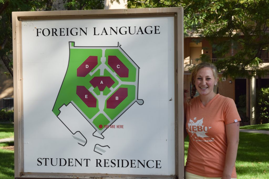 Claire Woodward, a senior studying German and history, stands by the Foreign Language Student Residence housing, where she used to work as a Language Facilitator.
