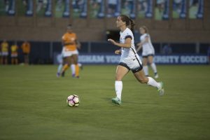 Brynlee Welch dribbles the ball downfield Friday night. The Cougars defeated Tennessee 5-2. (Gianluca Cuestas)