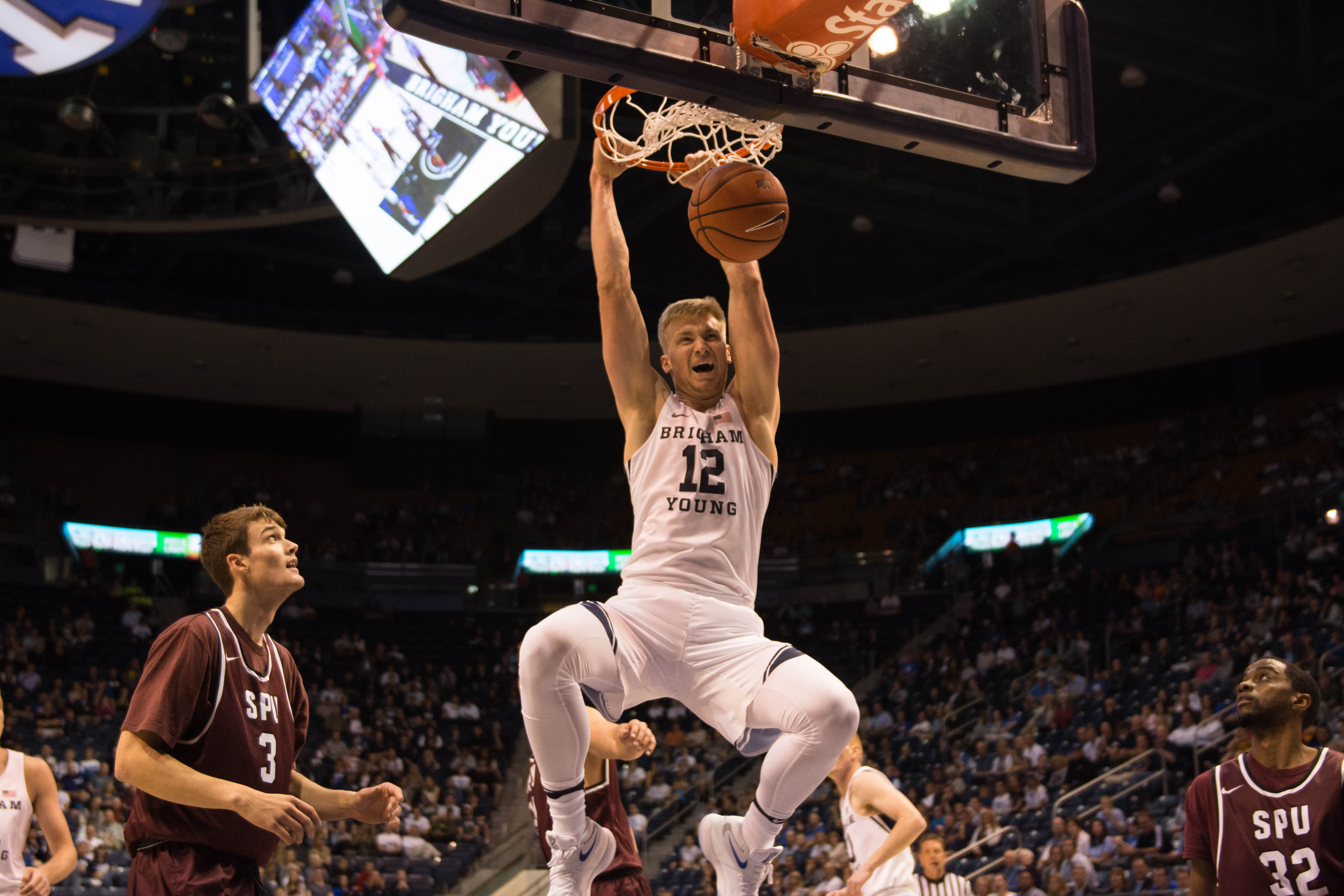 Eric Mika dunks during the Cougars' 20-point victory over Seattle Pacific. (Ryan Turner)