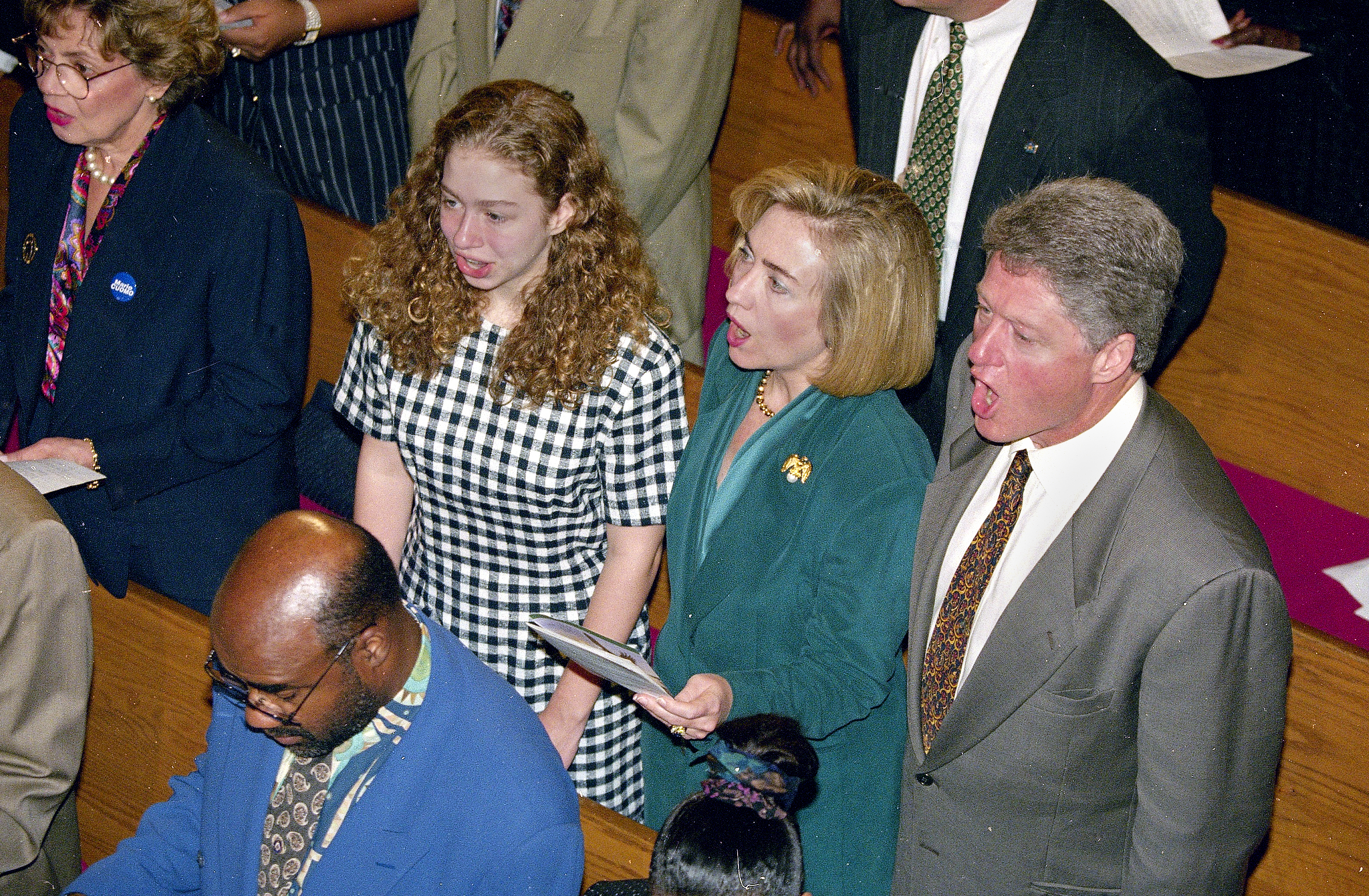FILE - In this Sept. 25, 1994 file photo, President Bill Clinton, first lady Hillary Rodham Clinton and their daughter, Chelsea, sing a hymn during church services at the Bethel African Methodist Church in the Harlem section of New York. Clinton is a lifelong Methodist. But the Rev. Bill Shillady _ who officiated at Chelsea Clinton's wedding, led a memorial service for Clinton’s mother, Dorothy Rodham, and gave the closing benediction at the Democratic National Convention _ feels that many people don't really know how much her faith "is a daily thing." (Associated Press)