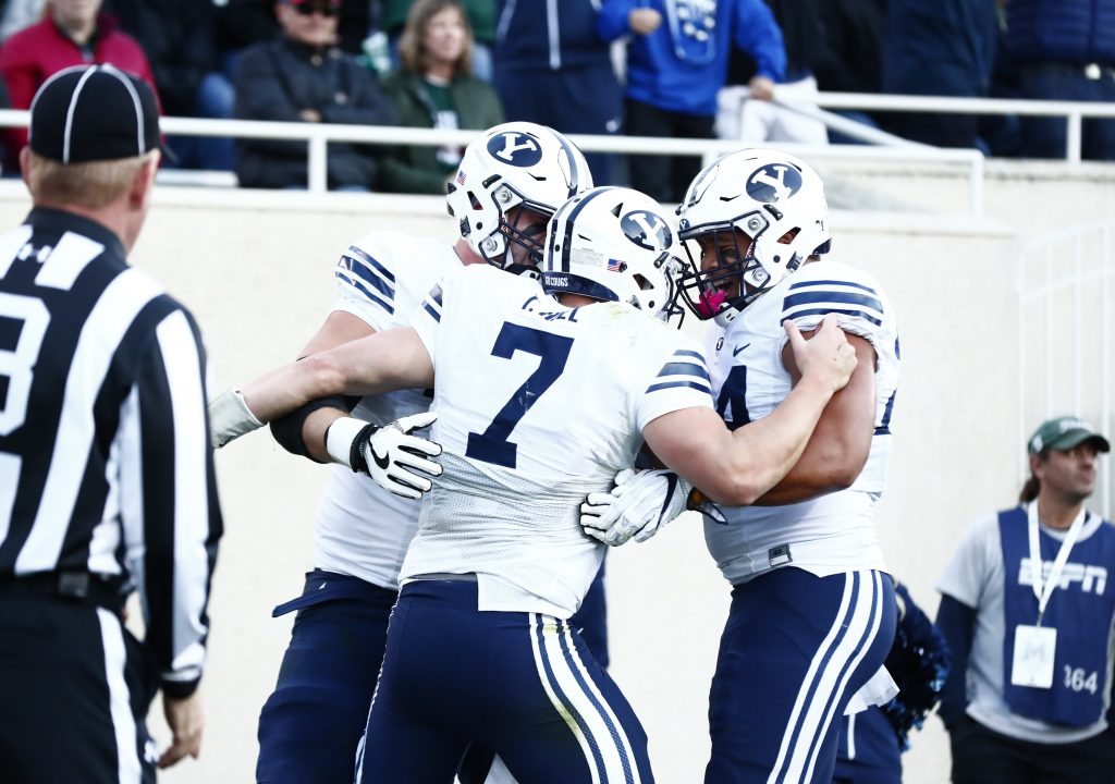 Taysom Hill celebrates with teammates after a BYU touchdown. (BYU Photo)