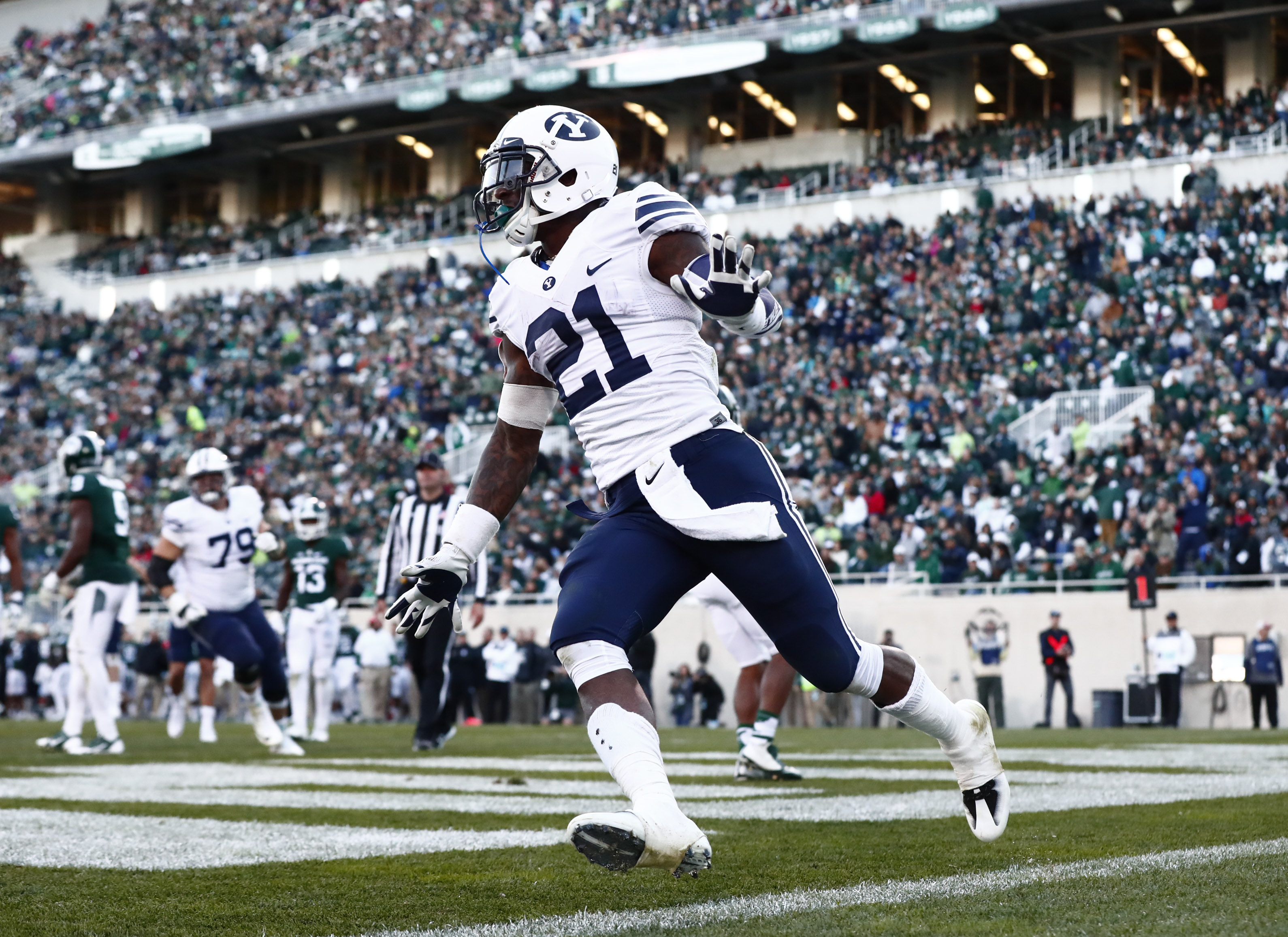 Jamaal Williams celebrates after scoring a touchdown against Michigan State. (BYU Photo)