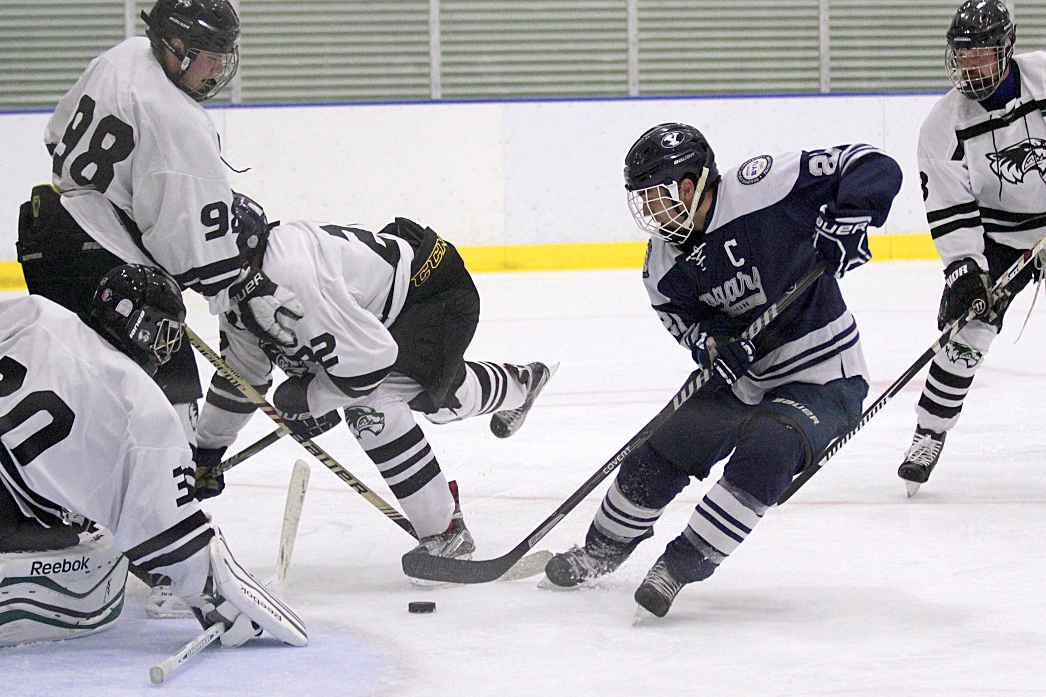 BYU hockey captain Ashton Shimbashi fights for the puck against UVU. (BYU Hockey)