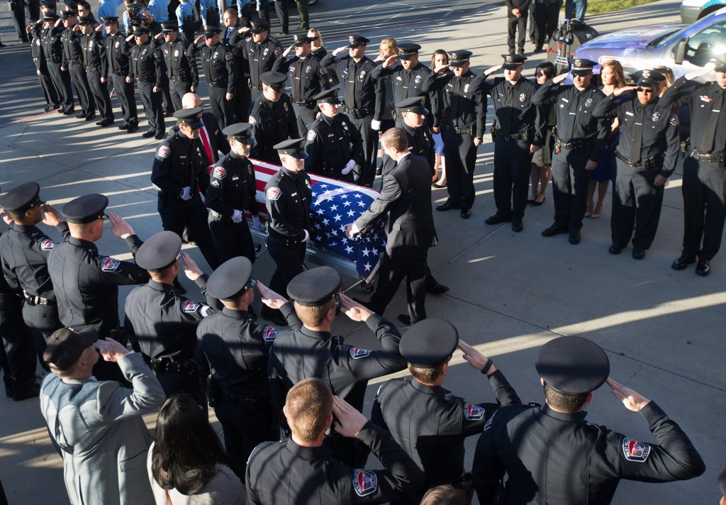 The casket of West Valley City Police officer Cody Brotherson arrives prior to funeral services at the Maverik Center in West Valley City, Utah, Monday, Nov. 14, 2016. Brotherson had been an officer in his hometown of West Valley City for almost three years when he was killed Nov. 6 while trying to help stop a stolen vehicle. (Scott G Winterton/The Deseret News via AP)