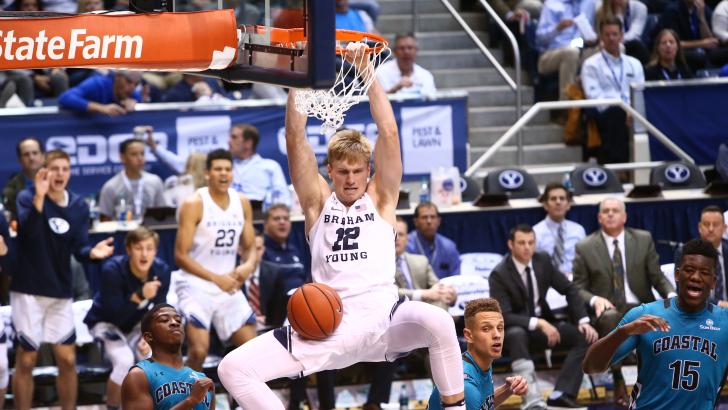 Eric Mika dunks the ball against Coastal Carolina. Mika recorded his third double-double in a victory over St. Louis. (BYU Photo)