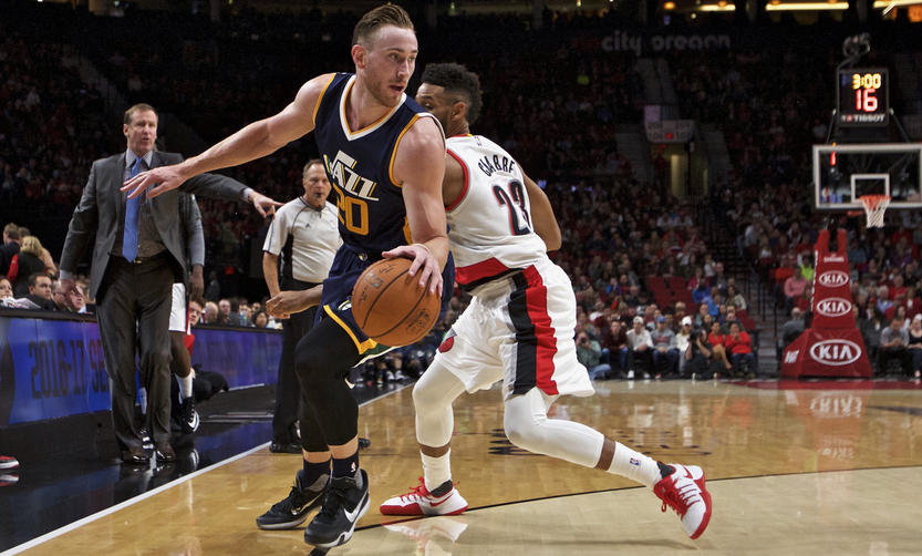 Jazz forward Gordon Hayward spins around Allen Crabbe. Hayward has only played in five games with point guard George Hill. (AP Photo)