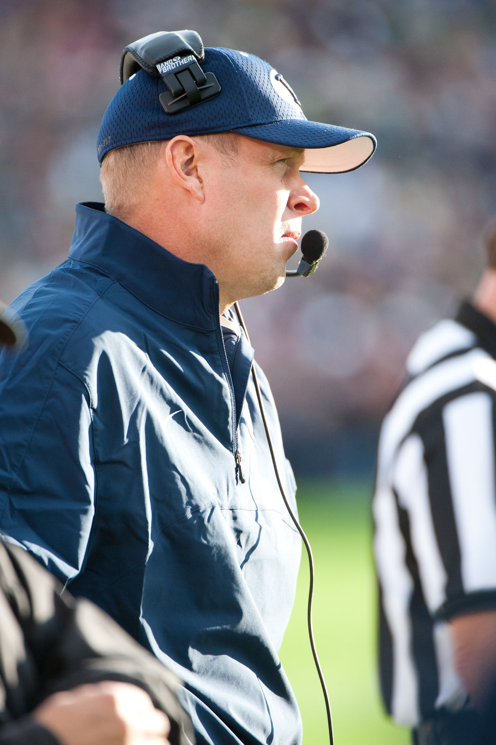 BYU head football coach Bronco Mendenhall looks out onto the field. by Chris Bunker.