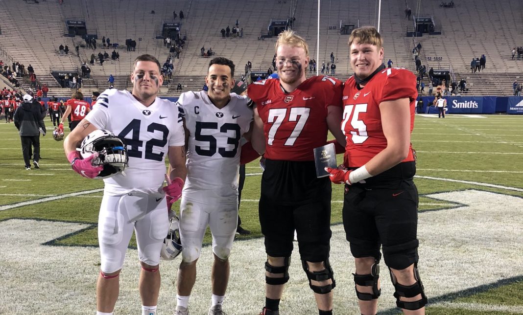 BYU Football players share Book of Mormon with opposing player after