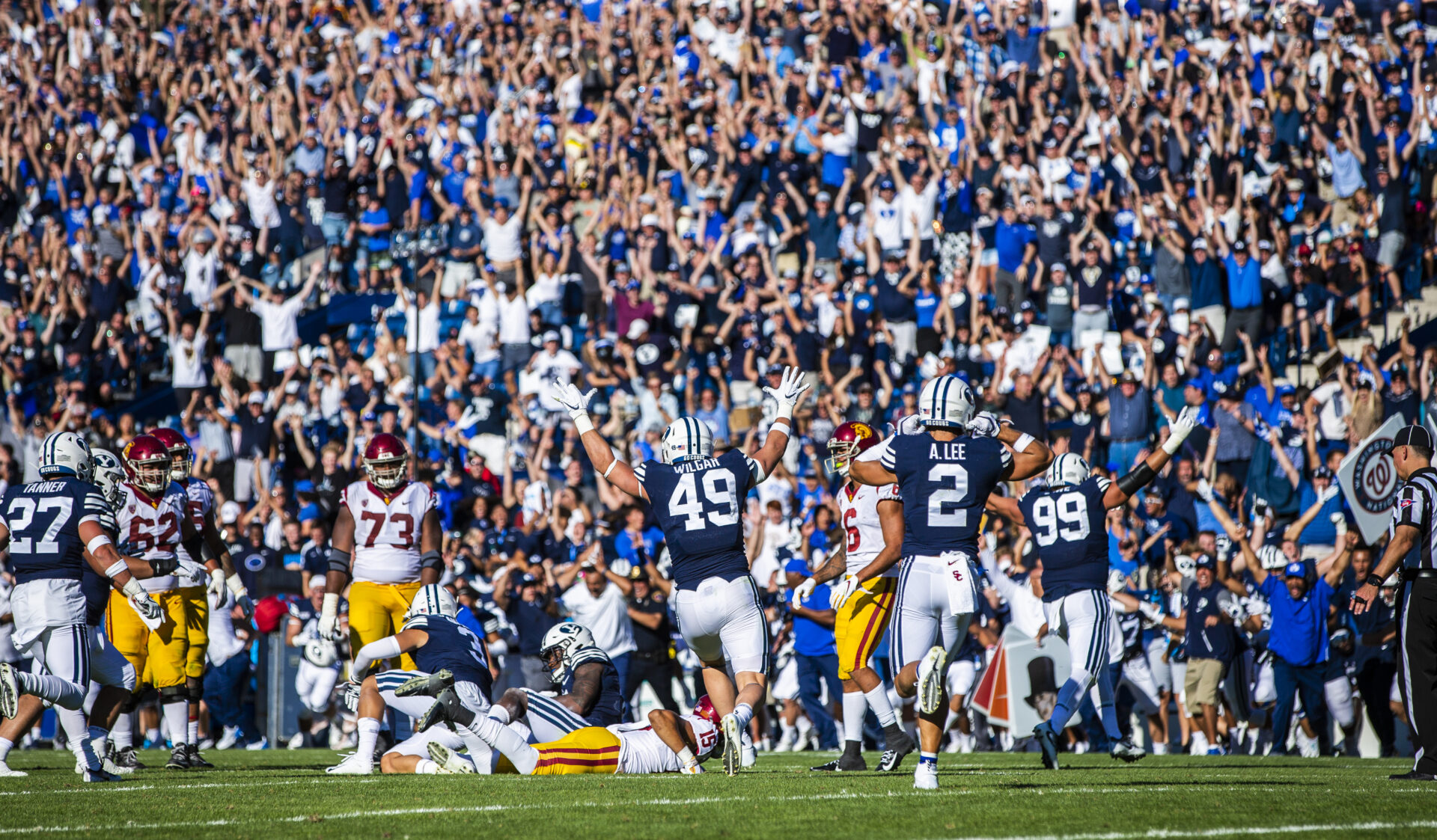 BYU celebrates defensive back Dayan Ghanwoluku's game-winning interception in the Cougars' 30-27 overtime win over No. 24 USC on Saturday, Sept. 14, 2019 at LaVell Edwards Stadium (BYU Photo). 
