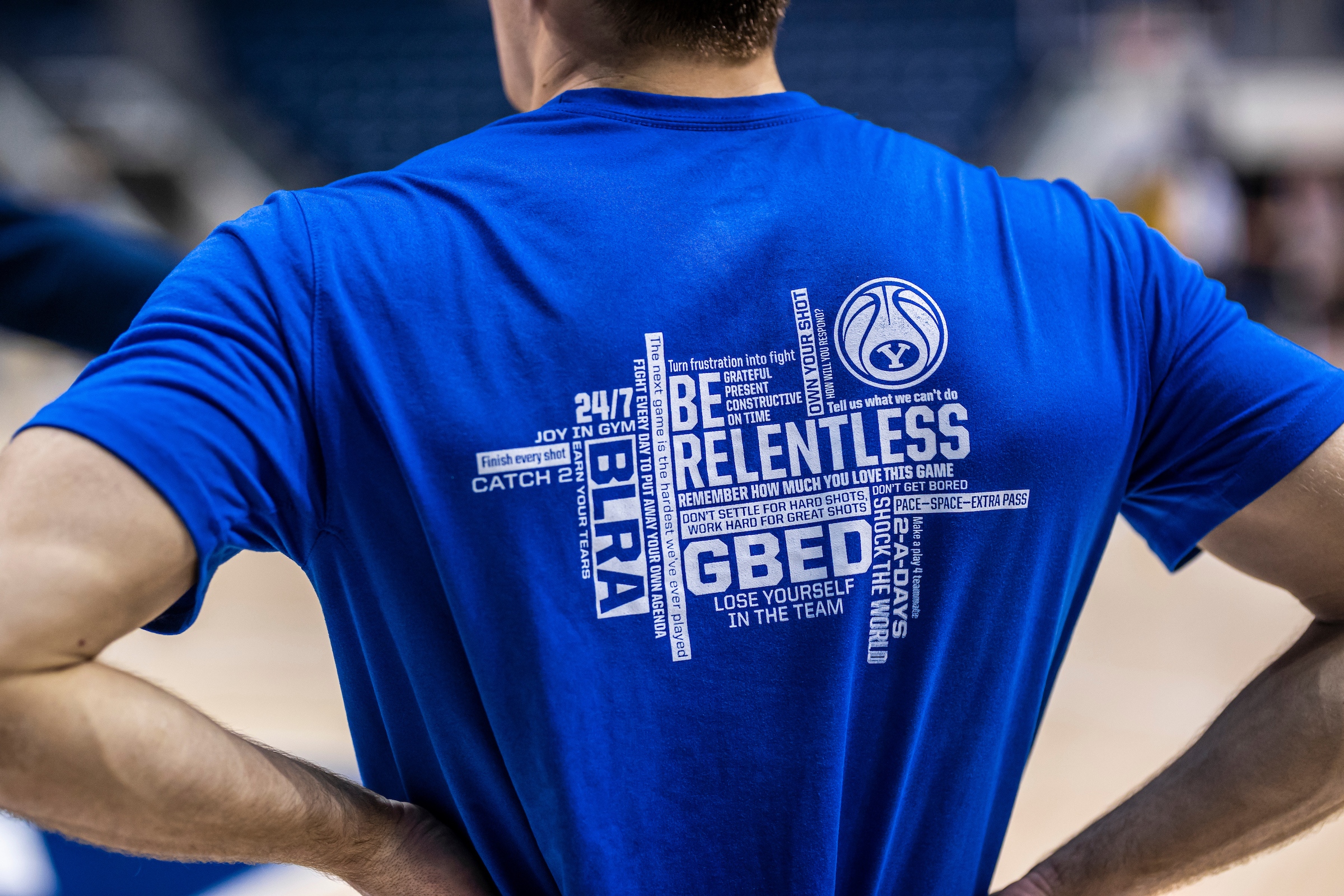 The BYU men's basketball "Word Wall" is displayed on the back of t-shirts worn by the players and staff.