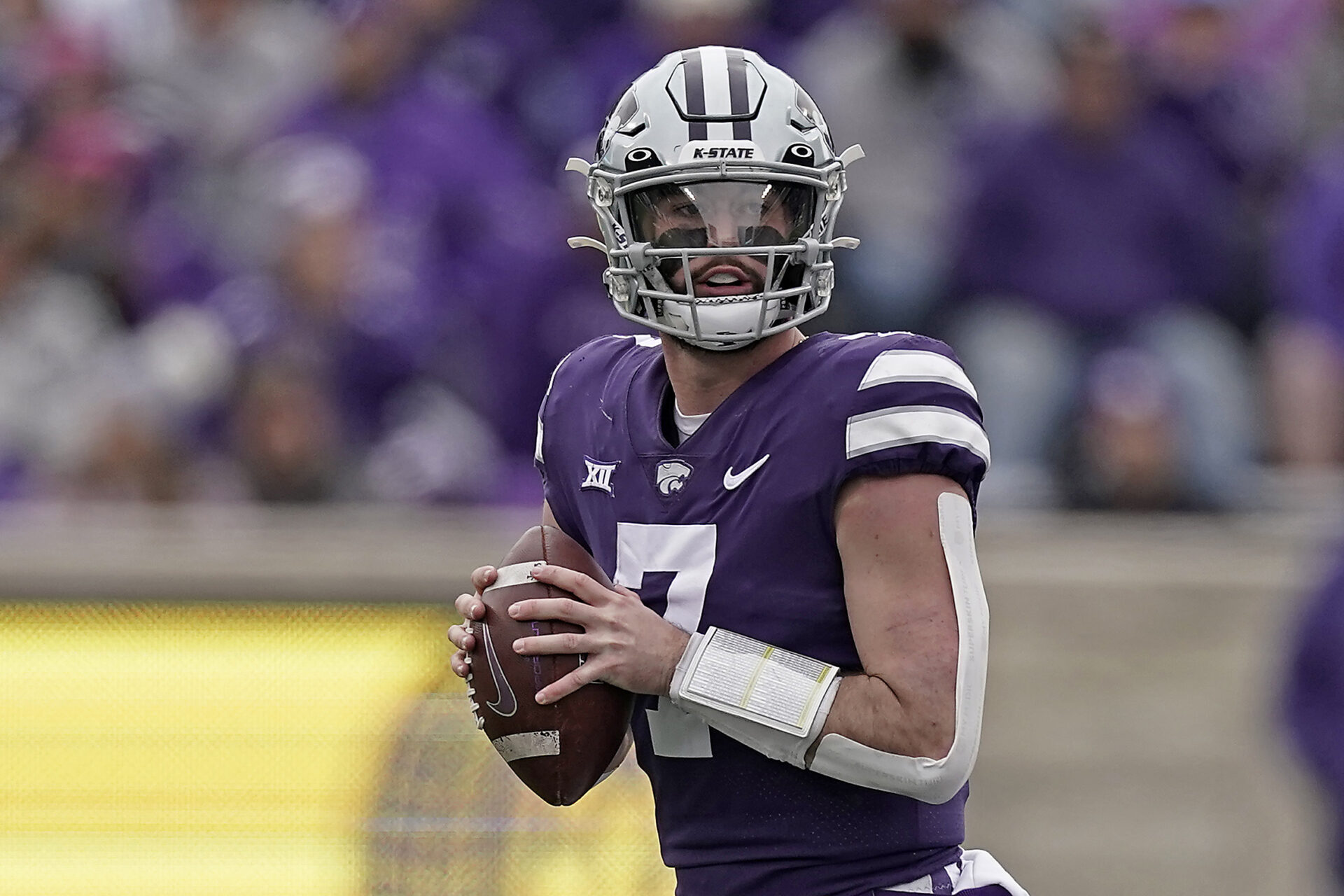 Kansas State quarterback Skylar Thompson looks for a receiver during the second half of an NCAA college football game against West Virginia, Saturday, Nov. 13, 2021, in Manhattan, Kan. (AP Photo/Charlie Riedel)